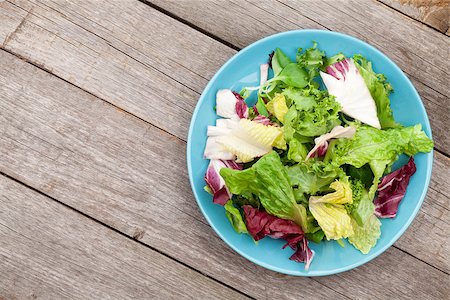 Fresh healthy salad on wooden table with copy space Stock Photo - Budget Royalty-Free & Subscription, Code: 400-07623574