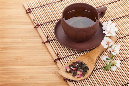 Japanese green tea and sakura branch over mat and bamboo table Stock Photo - Budget Royalty-Free & Subscription, Code: 400-07623847