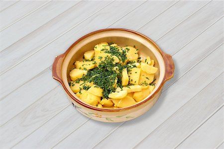 potato salad yellow - Greek potato salad with dill in a bowl on a white wooden table Stock Photo - Budget Royalty-Free & Subscription, Code: 400-07634059