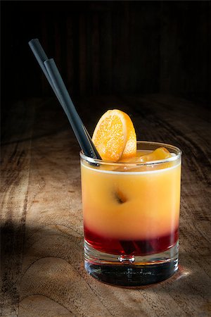 simsearch:400-05385152,k - Image of a exotic cocktail with rum and orange on a wooden table Stock Photo - Budget Royalty-Free & Subscription, Code: 400-07634184