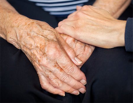 One young hand is consoling and laying on two old hands Photographie de stock - Aubaine LD & Abonnement, Code: 400-07630607