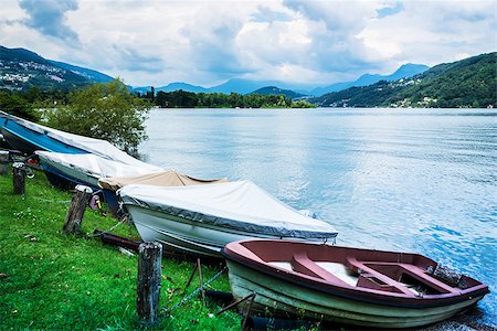 Lugano Lake, boats at rest on the grass in summer season, Switzerland Foto de stock - Royalty-Free Super Valor e Assinatura, Número: 400-07630617