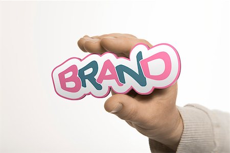 simsearch:400-08187507,k - One hand holding the word brand over a white background. Company identity concept. The image is a composition between 3D rendering and photography Stock Photo - Budget Royalty-Free & Subscription, Code: 400-07632509
