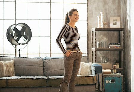 Young woman standing in loft apartment Stock Photo - Budget Royalty-Free & Subscription, Code: 400-07632627