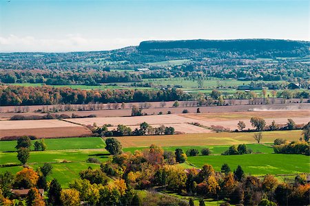 Autumn rural landscape and fields against escarpment in distance. Fotografie stock - Microstock e Abbonamento, Codice: 400-07632904