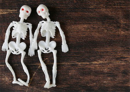 two funny skeleton on a black wooden board Stock Photo - Budget Royalty-Free & Subscription, Code: 400-07633528