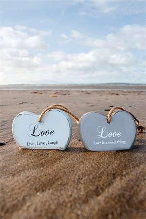 simsearch:400-08495448,k - two inscribed wooden love hearts in the sand on a wild Atlantic way Irish beach in summer Stock Photo - Budget Royalty-Free & Subscription, Code: 400-07656548