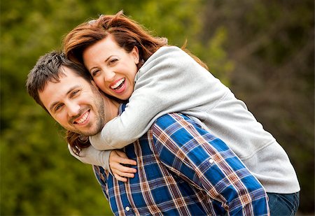 young couple wearing casual outfits in the park Fotografie stock - Microstock e Abbonamento, Codice: 400-07656569