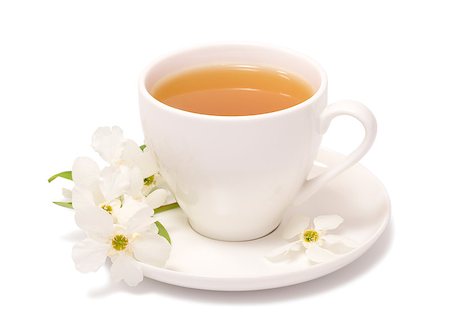 Cup with tea and a sprig of blooming jasmine on a saucer Stock Photo - Budget Royalty-Free & Subscription, Code: 400-07657808