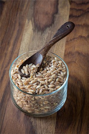 simsearch:400-08428404,k - Loose grains of farro in a bowl with a spoon. Stock Photo - Budget Royalty-Free & Subscription, Code: 400-07658096