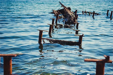 fragments sticking out of the sea berth Stock Photo - Budget Royalty-Free & Subscription, Code: 400-07658404