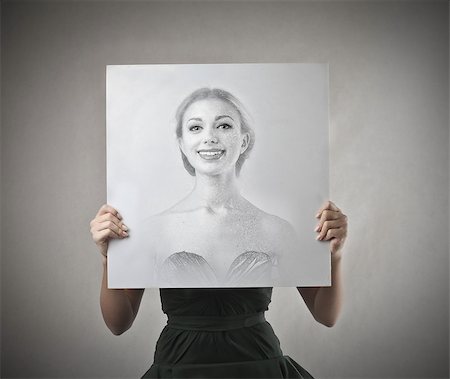 draw close up face - Woman holding a cardboard with her face drawn Stock Photo - Budget Royalty-Free & Subscription, Code: 400-07658529