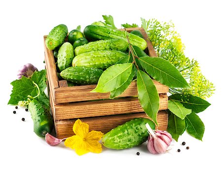 simsearch:400-07667021,k - Fresh cucumbers in wooden box with green leaf and flower. Isolated on white background Stock Photo - Budget Royalty-Free & Subscription, Code: 400-07658916