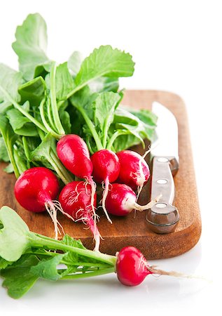 simsearch:400-07667021,k - Bundle radish on wooden board with knife. Isolated on white background Stock Photo - Budget Royalty-Free & Subscription, Code: 400-07659051