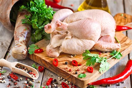 simsearch:400-07713408,k - Raw chicken with spices and cilantro ready to be prepared Stock Photo - Budget Royalty-Free & Subscription, Code: 400-07659067