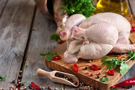simsearch:400-07713408,k - Raw chicken with spices and cilantro ready to be prepared. Copy space background. Stock Photo - Budget Royalty-Free & Subscription, Code: 400-07659069