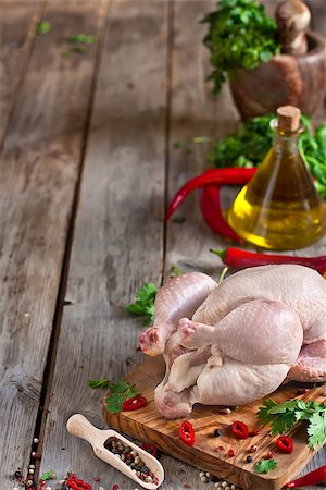 simsearch:400-07713408,k - Raw chicken with spices and cilantro ready to be prepared. Copy space background. Stock Photo - Budget Royalty-Free & Subscription, Code: 400-07659070