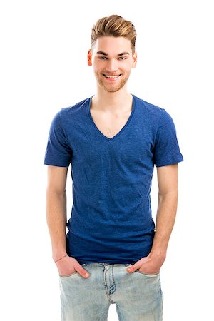 Good looking young man smiling with hands in the pockets, isolated on white background Stock Photo - Budget Royalty-Free & Subscription, Code: 400-07659350
