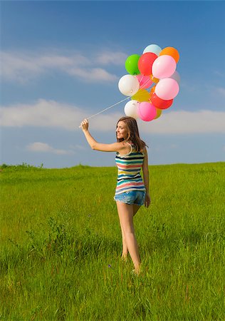 simsearch:400-06077546,k - Young beautiful woman with colorful balloons on a green meadow Stockbilder - Microstock & Abonnement, Bildnummer: 400-07659386