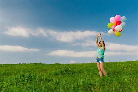 simsearch:400-06077546,k - Young beautiful woman with colorful balloons on a green meadow Stockbilder - Microstock & Abonnement, Bildnummer: 400-07659387