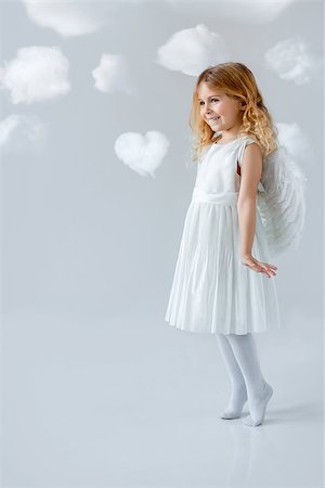 Little pretty girl with clouds Stock Photo - Budget Royalty-Free & Subscription, Code: 400-07659396