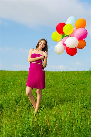 simsearch:400-06077546,k - Young beautiful woman with colorful balloons on a green meadow Stockbilder - Microstock & Abonnement, Bildnummer: 400-07659390