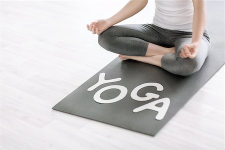 female yoga feet - Woman in lotus position with the word "yoga" Stock Photo - Budget Royalty-Free & Subscription, Code: 400-07659402