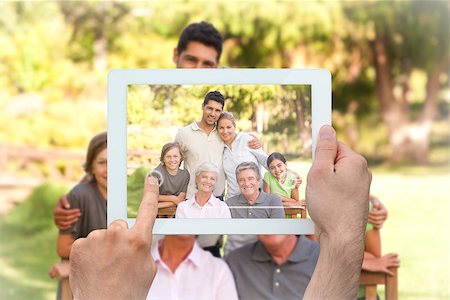 family with tablet in the park - Hand holding tablet pc showing family in the park Stock Photo - Budget Royalty-Free & Subscription, Code: 400-07664000