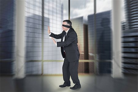 simsearch:400-07665425,k - Composite image of mature businessman in a blindfold walk in a large room Stockbilder - Microstock & Abonnement, Bildnummer: 400-07664073