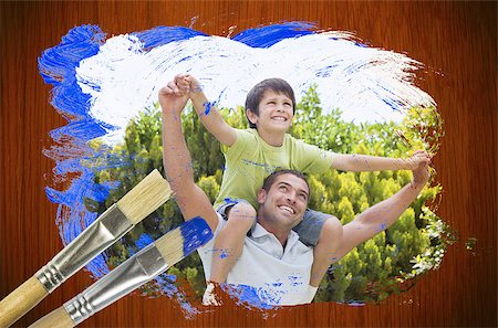 Composite image of father and son in the park against surface with paintbrushes Stock Photo - Budget Royalty-Free & Subscription, Code: 400-07664100