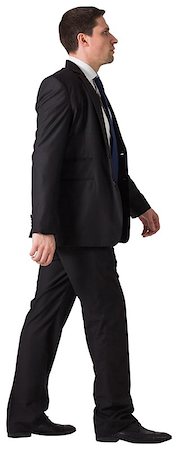 Handsome businessman in suit stepping on white background Stock Photo - Budget Royalty-Free & Subscription, Code: 400-07664293