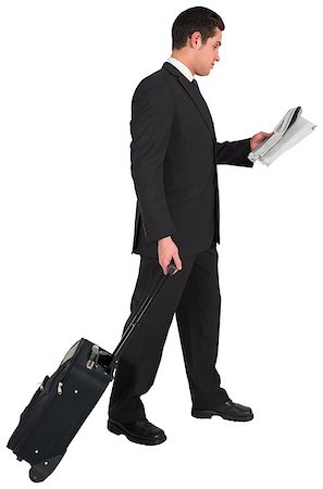 Businessman pulling his suitcase holding newspaper on white background Stock Photo - Budget Royalty-Free & Subscription, Code: 400-07664362