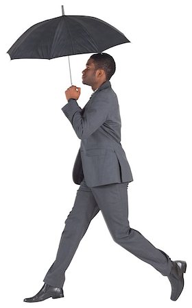 simsearch:400-07665425,k - Businessman walking and holding umbrella on white background Stockbilder - Microstock & Abonnement, Bildnummer: 400-07664531