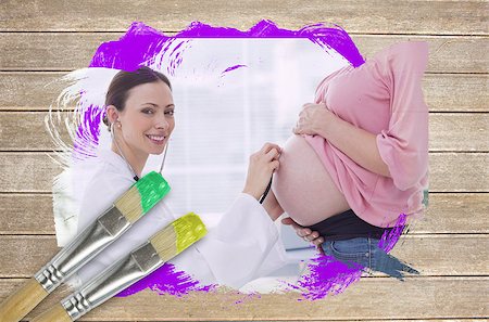 Composite image of pregnant woman at check up with doctor with paintbrush dipped in yellow against wooden surface with planks Stock Photo - Budget Royalty-Free & Subscription, Code: 400-07665022