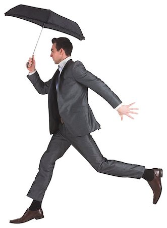 Businessman jumping holding an umbrella on white background Photographie de stock - Aubaine LD & Abonnement, Code: 400-07665077