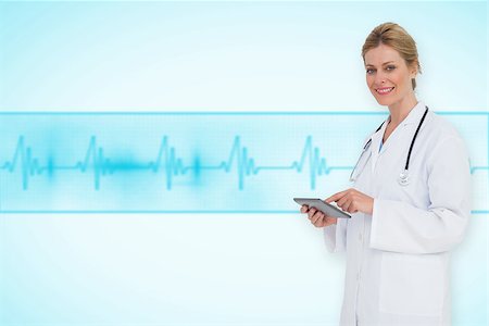 ecg electrodes - Blonde doctor using tablet pc against medical background with blue ecg line Stock Photo - Budget Royalty-Free & Subscription, Code: 400-07665108