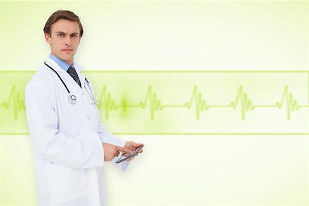 ecg electrodes - Young doctor using tablet pc against medical background with green ecg line Stock Photo - Budget Royalty-Free & Subscription, Code: 400-07665100
