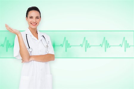 ecg electrodes - Pretty nurse presenting against green medical background with ecg line Stock Photo - Budget Royalty-Free & Subscription, Code: 400-07665103