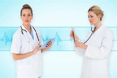 ecg electrodes - Composite image of female medical team against medical background with blue ecg line Stock Photo - Budget Royalty-Free & Subscription, Code: 400-07665119