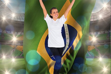 Excited football fan in white cheering holding brazil flag against large football stadium with brasilian fans Stock Photo - Budget Royalty-Free & Subscription, Code: 400-07665226
