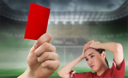 Hand holding up red card against football pitch in large stadium with fan Stock Photo - Budget Royalty-Free & Subscription, Code: 400-07665258