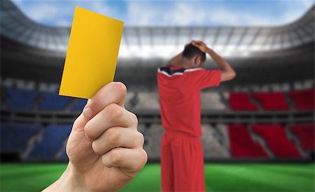 simsearch:400-07665266,k - Hand holding up yellow card against stadium full of france football fans with player Stock Photo - Budget Royalty-Free & Subscription, Code: 400-07665266