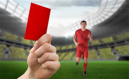 simsearch:400-07665266,k - Hand holding up red card against football stadium and player Stock Photo - Budget Royalty-Free & Subscription, Code: 400-07665262