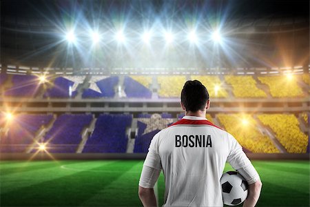 simsearch:400-07665266,k - Bosnia football player holding ball against stadium full of bosnia football fans Stock Photo - Budget Royalty-Free & Subscription, Code: 400-07665344