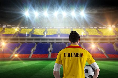 simsearch:400-07665266,k - Colombia football player holding ball against stadium full of colombia football fans Stock Photo - Budget Royalty-Free & Subscription, Code: 400-07665348