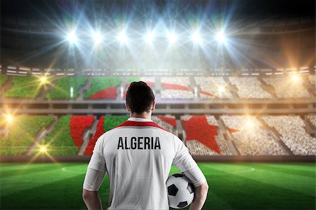 simsearch:400-07665266,k - Algeria football player holding ball against stadium full of algeria football fans Stock Photo - Budget Royalty-Free & Subscription, Code: 400-07665341