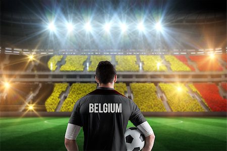 simsearch:400-07665266,k - Belgium football player holding ball against stadium full of belgium football fans Stock Photo - Budget Royalty-Free & Subscription, Code: 400-07665343