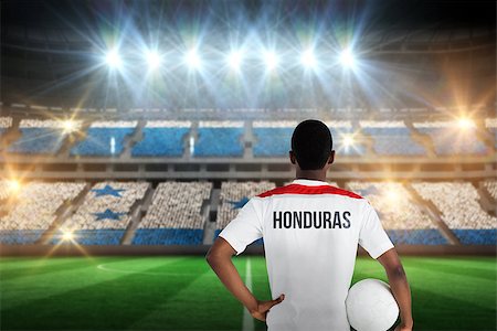 simsearch:400-07665266,k - Honduras football player holding ball against stadium full of honduras football fans Stock Photo - Budget Royalty-Free & Subscription, Code: 400-07665355
