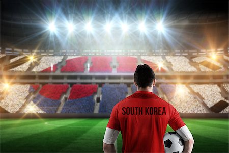 simsearch:400-07665266,k - South korea football player holding ball against stadium full of korea football fans Stock Photo - Budget Royalty-Free & Subscription, Code: 400-07665365