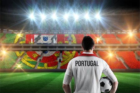 simsearch:400-07665266,k - Portugal football player holding ball against stadium full of portugal football fans Stock Photo - Budget Royalty-Free & Subscription, Code: 400-07665363